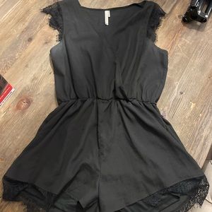 Large black paper crane romper with lace details